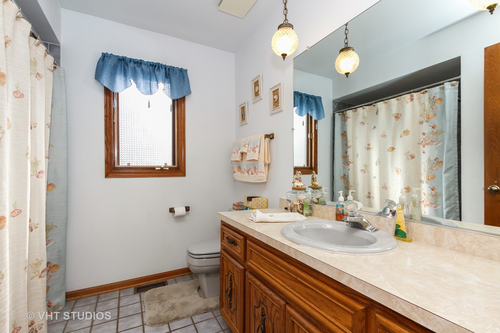6931 Coachwood Trail Tinley Park, IL 60477 - Photo 9 of 11 a bathroom with a sink a toilet and a mirror