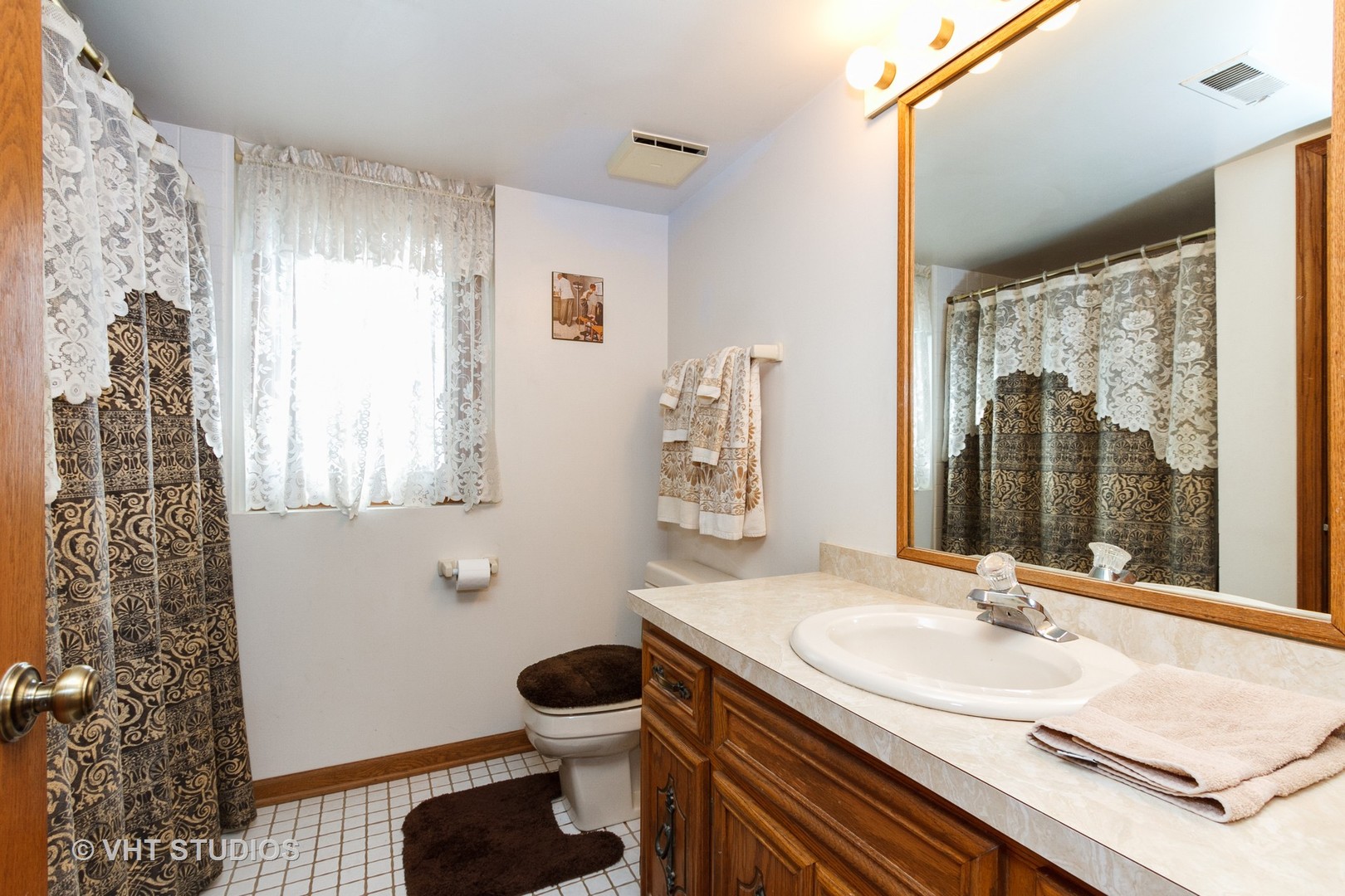 6931 Coachwood Trail Tinley Park, IL 60477 - Photo 10 of 11 a bathroom with a sink toilet a mirror and shower