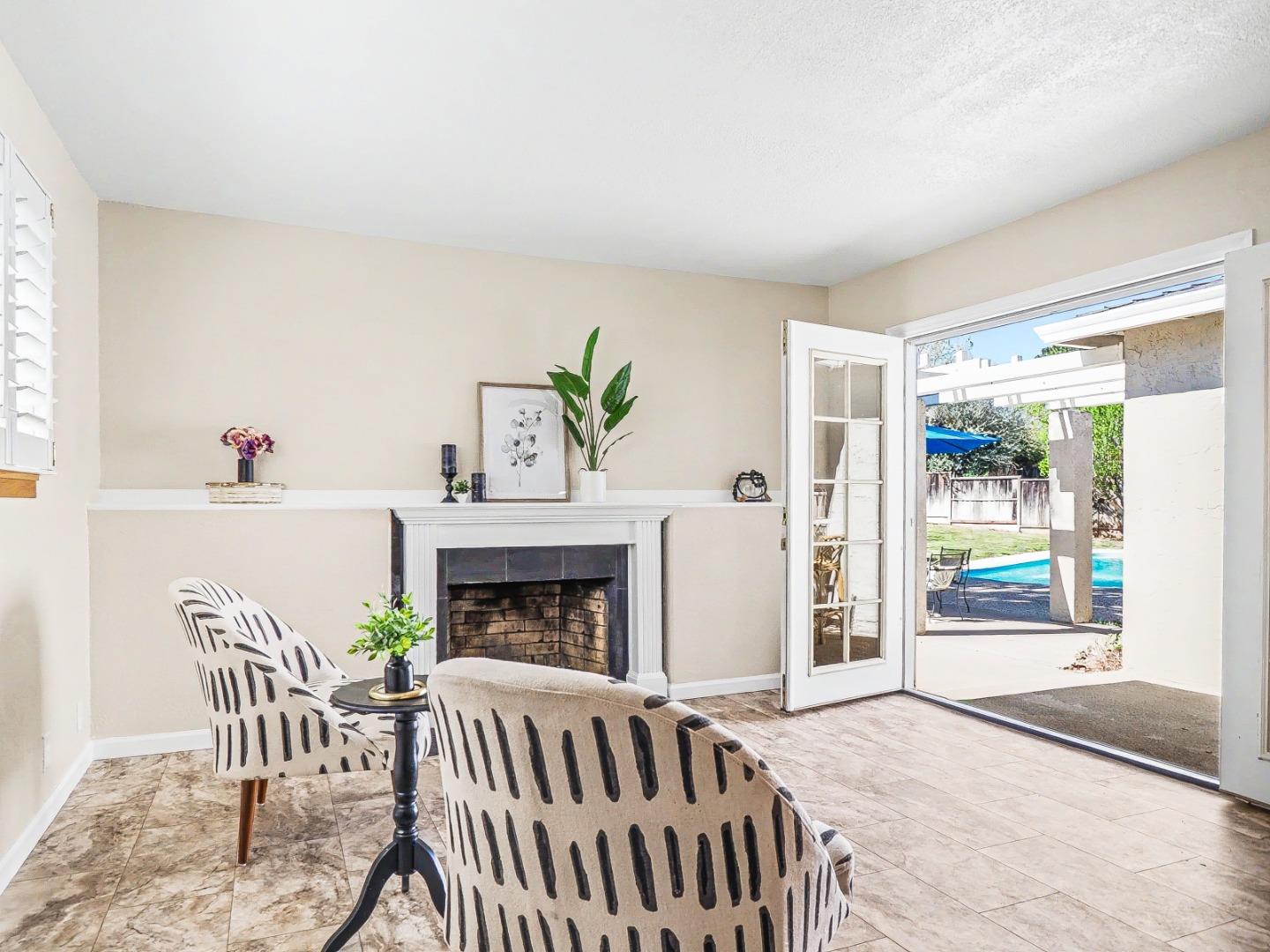 6455 Kensington Place Gilroy, CA 95020 - Photo 15 of 32 a living room with furniture and a fireplace