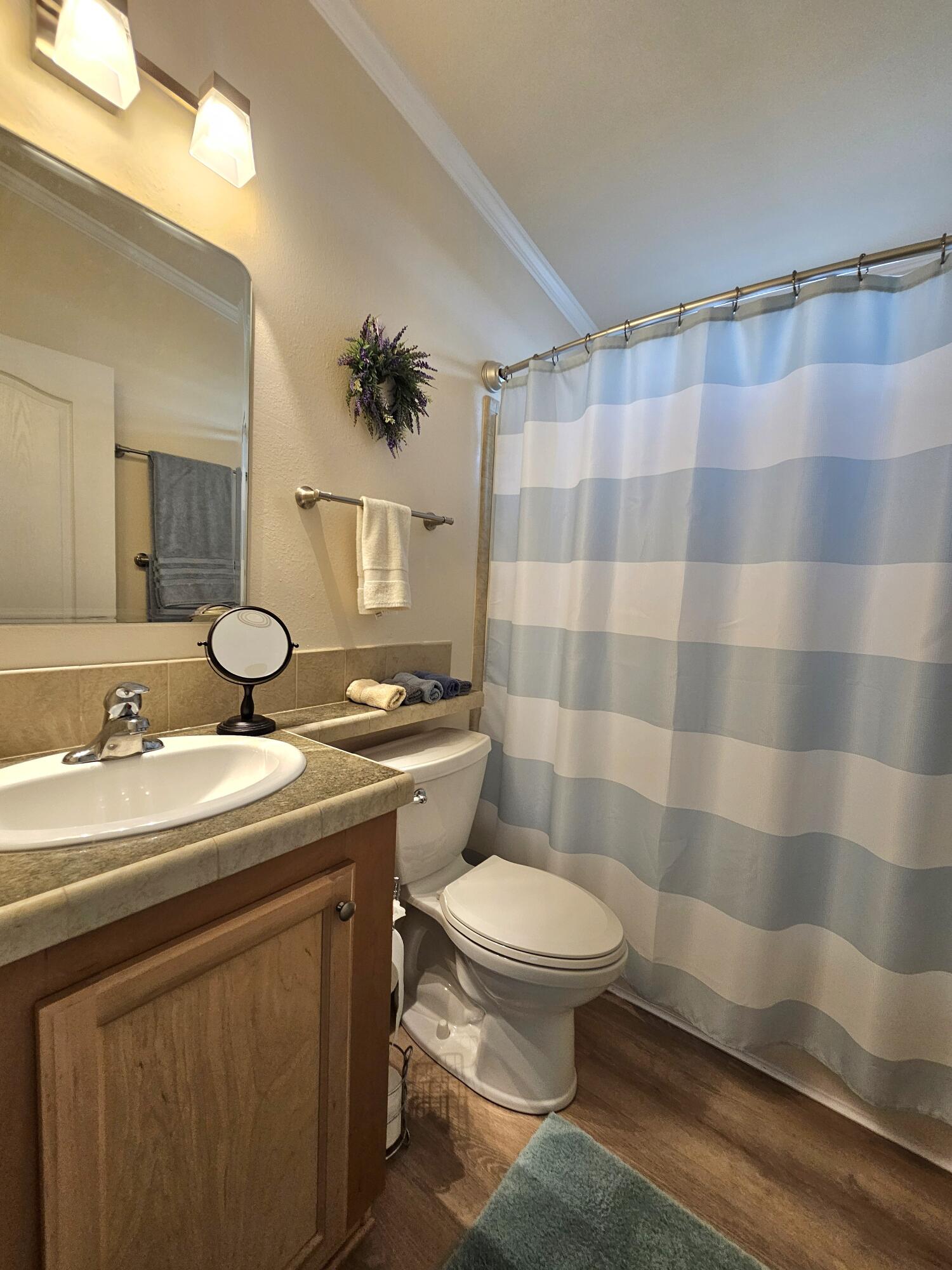 7902 Southeast 95th Trail Okeechobee, FL 34974 - Photo 20 of 36 a bathroom with a sink toilet and shower