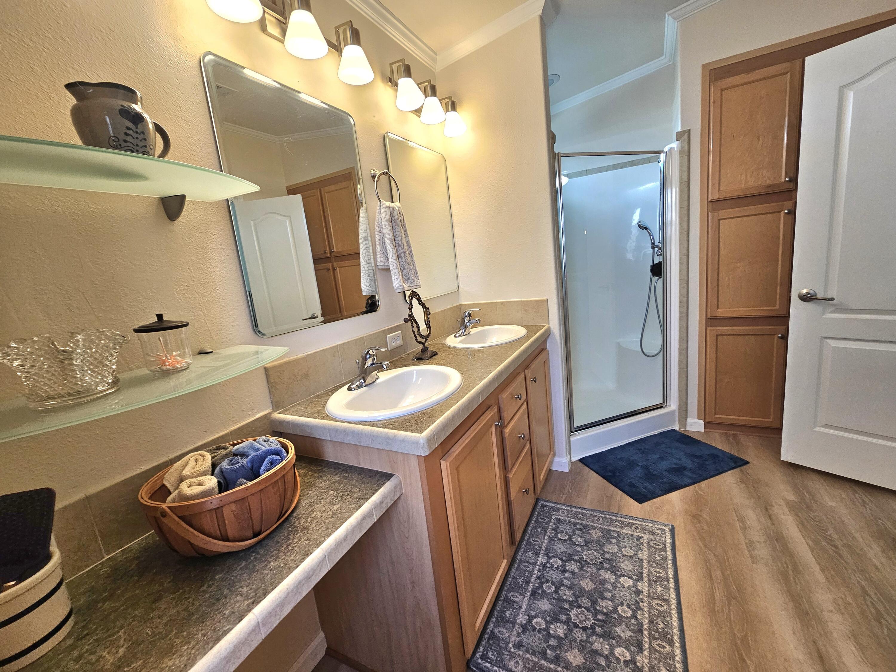 7902 Southeast 95th Trail Okeechobee, FL 34974 - Photo 25 of 36 a bathroom with a sink and a mirror