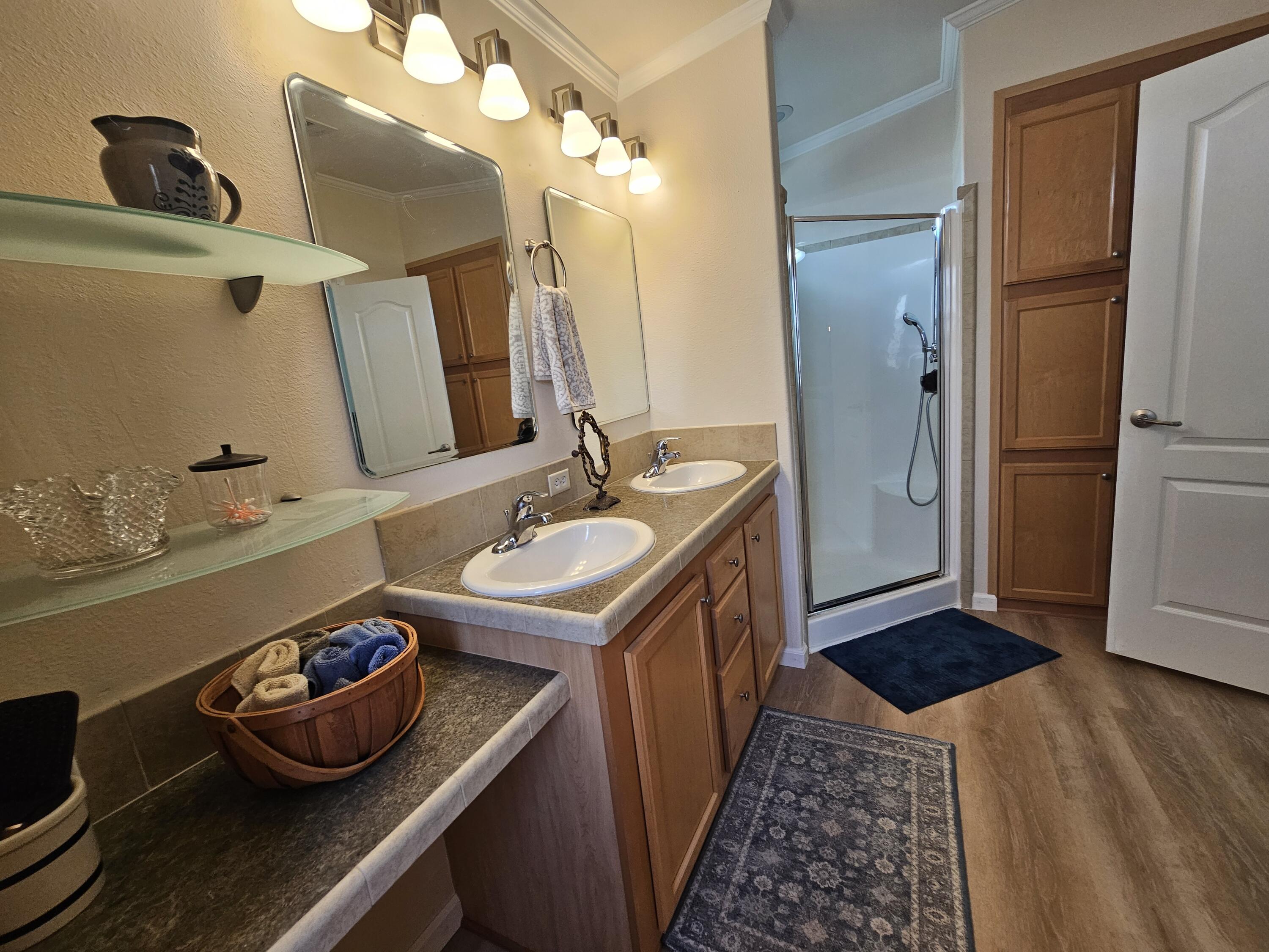 7902 Southeast 95th Trail Okeechobee, FL 34974 - Photo 26 of 36 a bathroom with a sink and a mirror