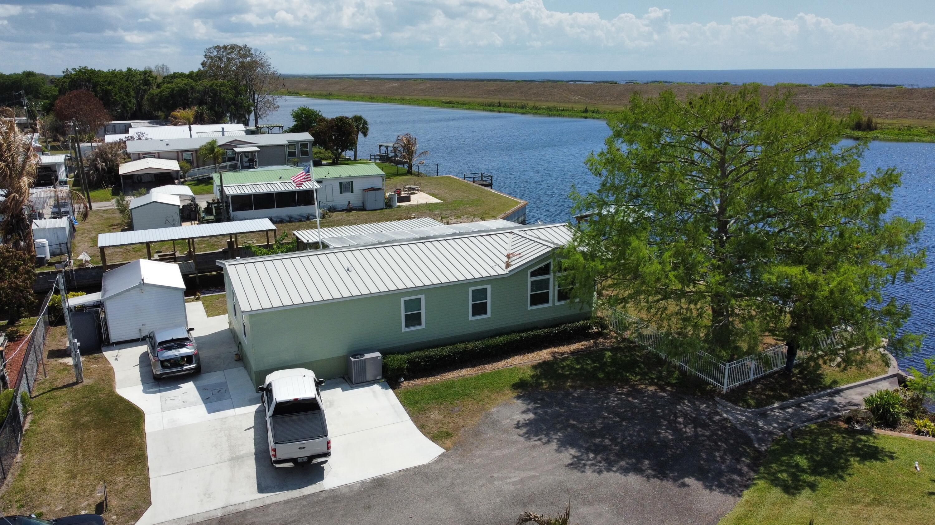 7902 Southeast 95th Trail Okeechobee, FL 34974 - Photo 28 of 36 an aerial view of a house with lake view