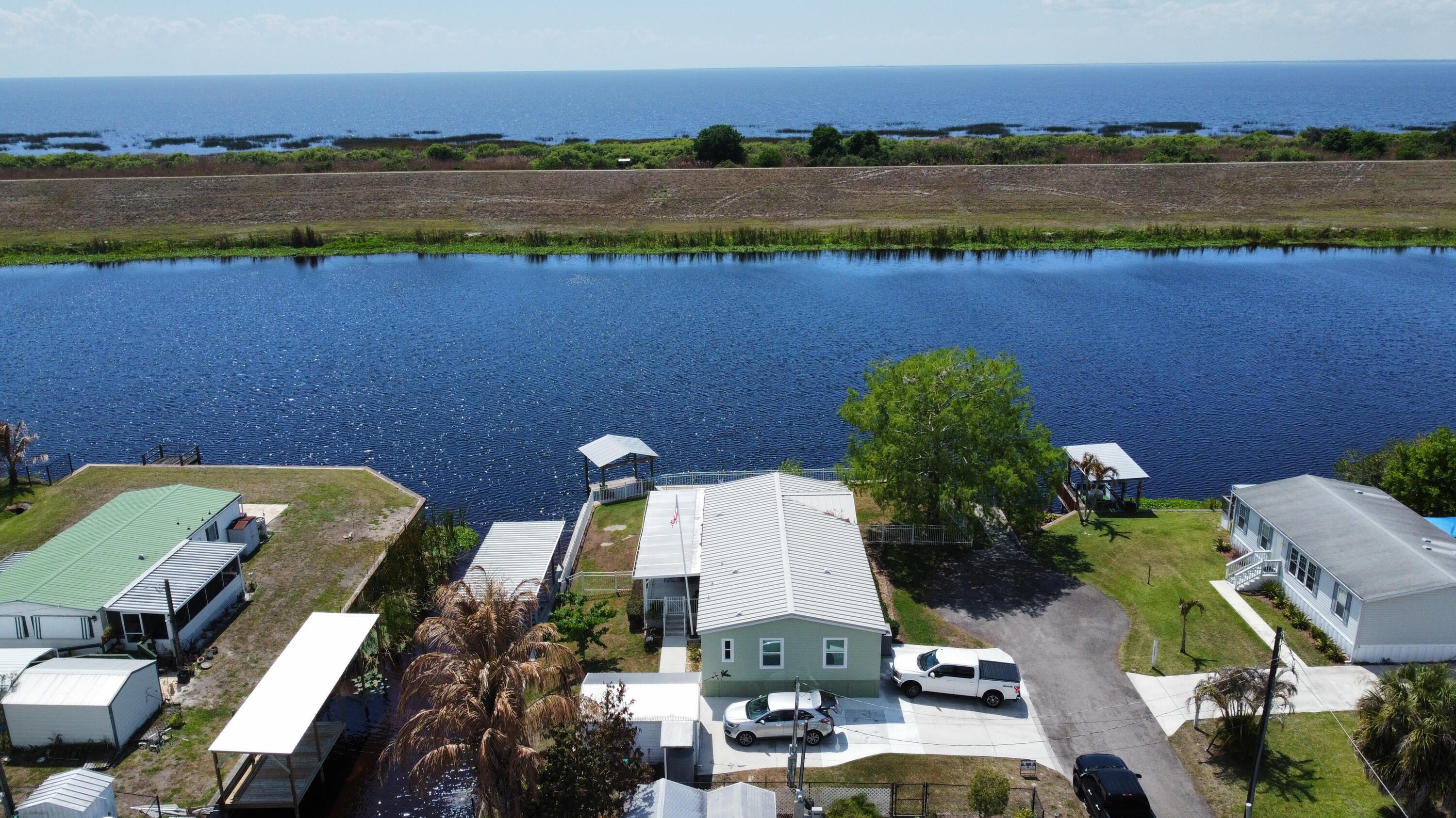 7902 Southeast 95th Trail Okeechobee, FL 34974 - Photo 30 of 36 a view of a lake with outdoor space