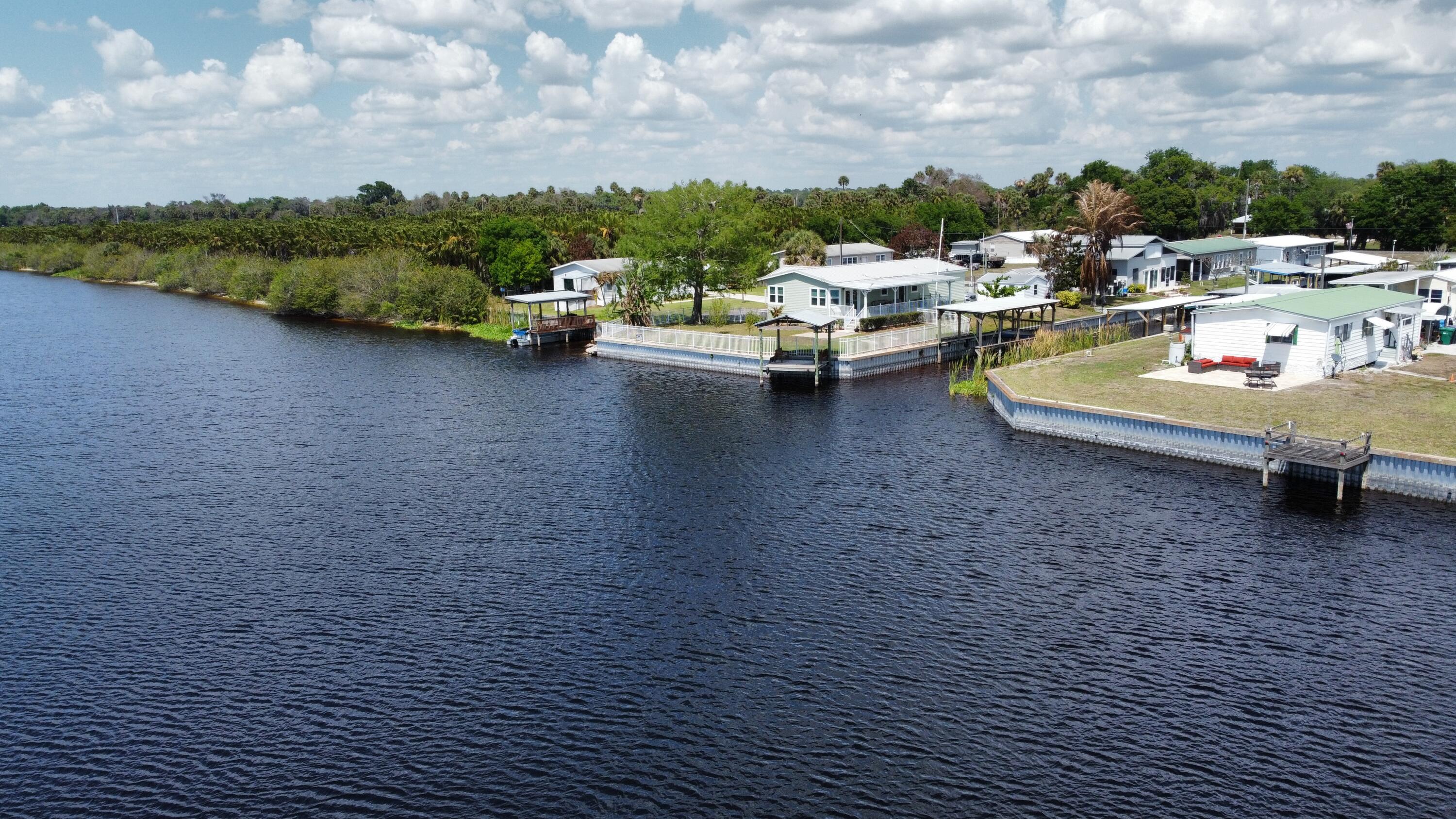 7902 Southeast 95th Trail Okeechobee, FL 34974 - Photo 31 of 36 a view of a terrace with lawn chairs