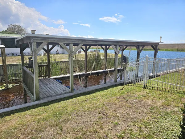 a kitchen with stainless steel appliances a refrigerator and wooden floor