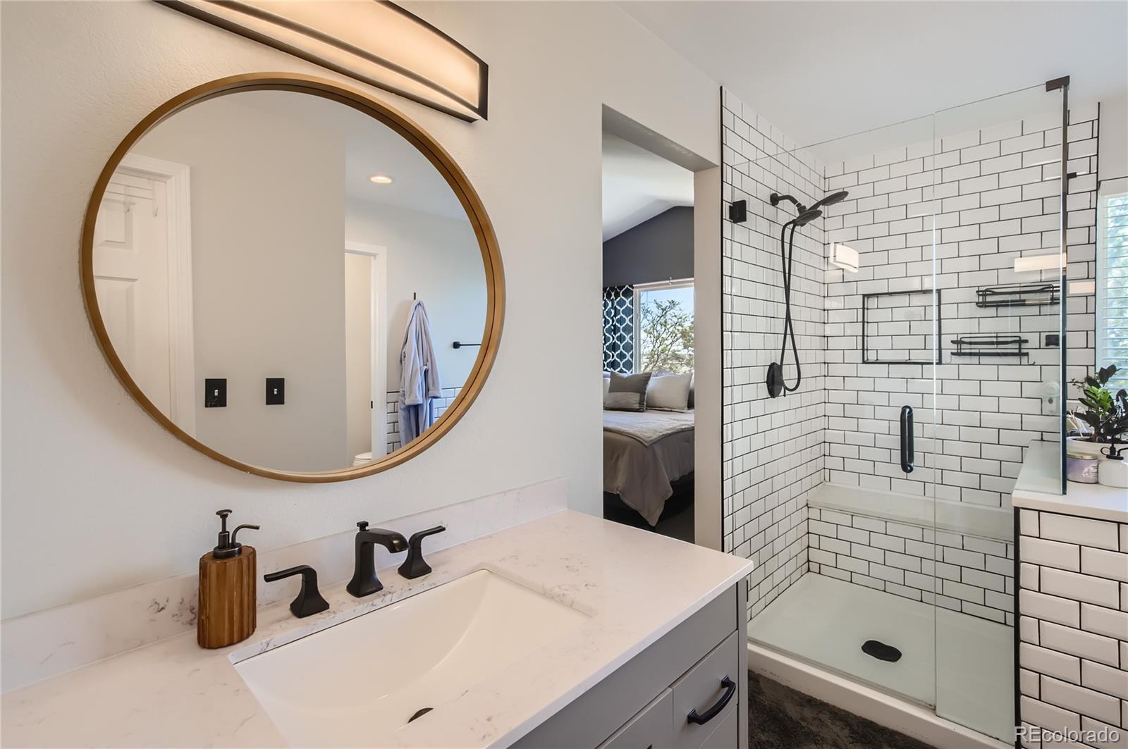 8481 West 95th Drive Westminster, CO 80021 - Photo 11 of 28 a bathroom with a sink and a mirror
