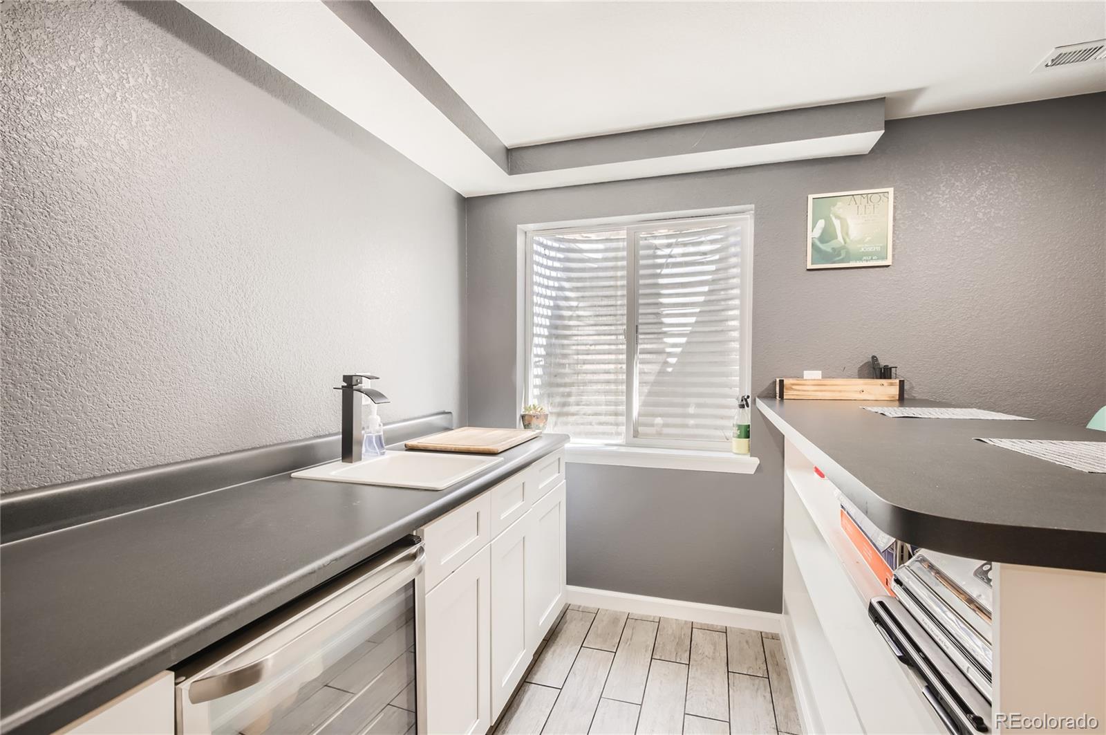8481 West 95th Drive Westminster, CO 80021 - Photo 20 of 28 a utility room with a sink dryer and washer
