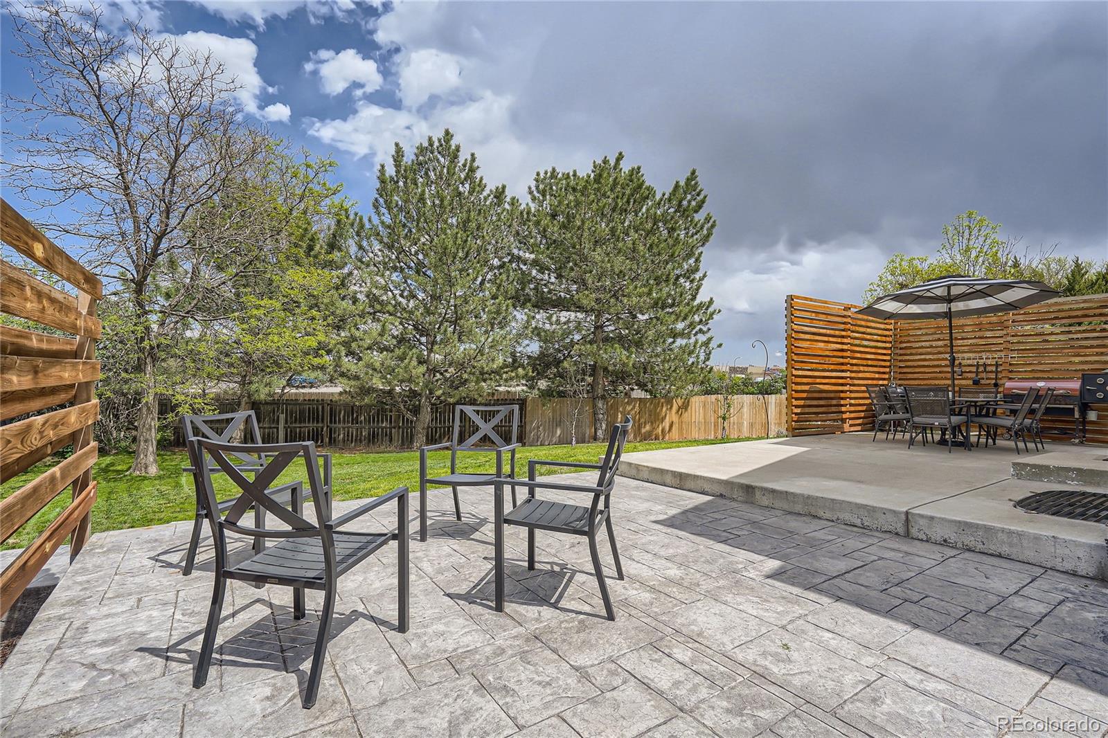 8481 West 95th Drive Westminster, CO 80021 - Photo 22 of 28 a view of a chairs and table in the patio