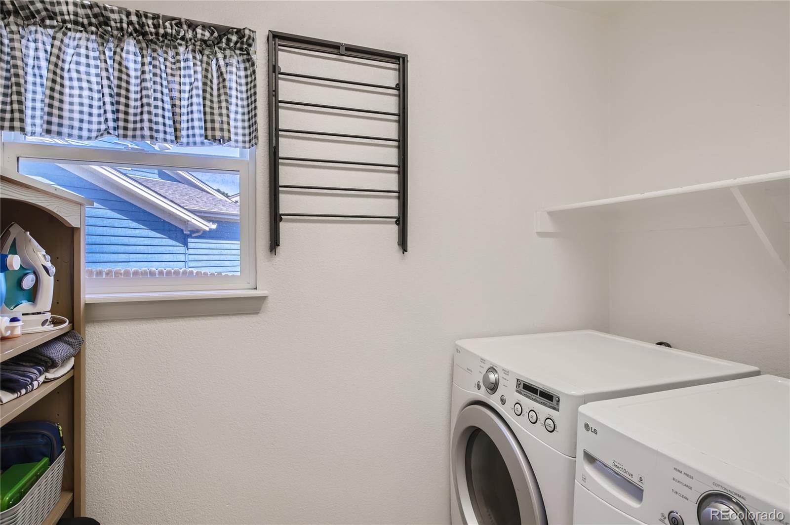8481 West 95th Drive Westminster, CO 80021 - Photo 26 of 28 a utility room with dryer and washer