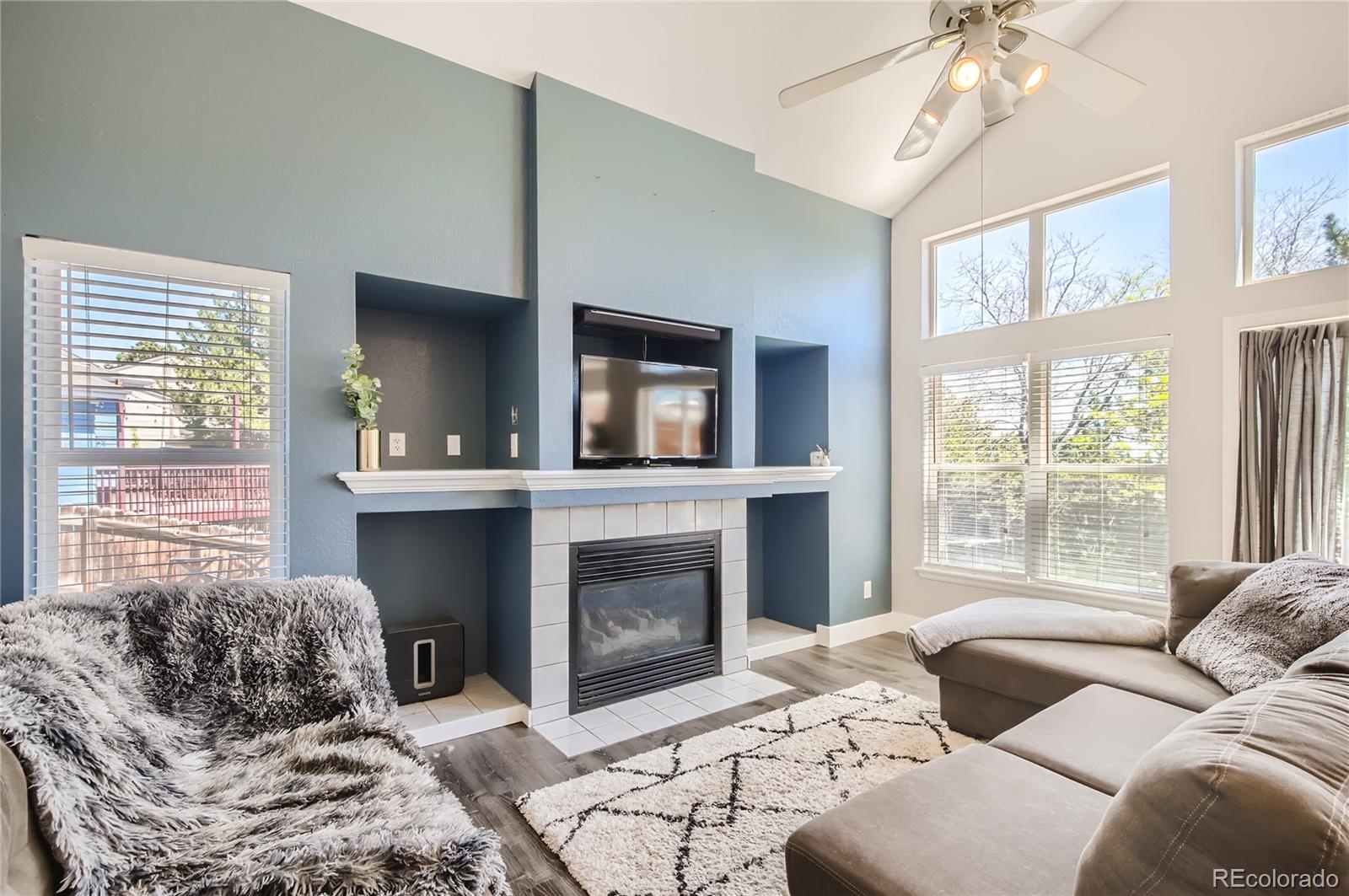 8481 West 95th Drive Westminster, CO 80021 - Photo 4 of 28 a bedroom with a bed and a fireplace