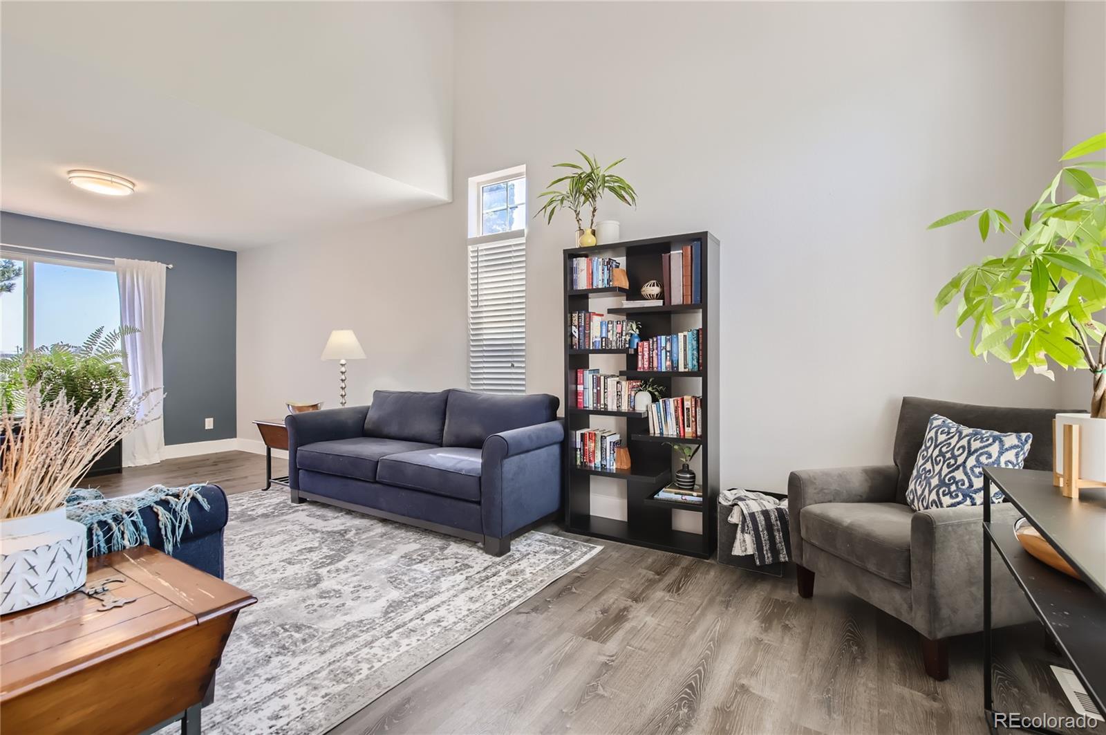 8481 West 95th Drive Westminster, CO 80021 - Photo 5 of 28 a living room with furniture and a wooden floor