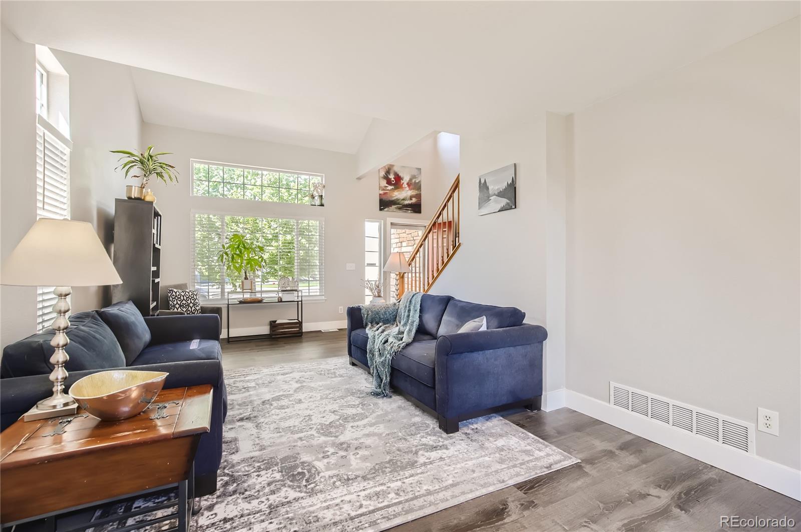 8481 West 95th Drive Westminster, CO 80021 - Photo 6 of 28 a living room with furniture and a window