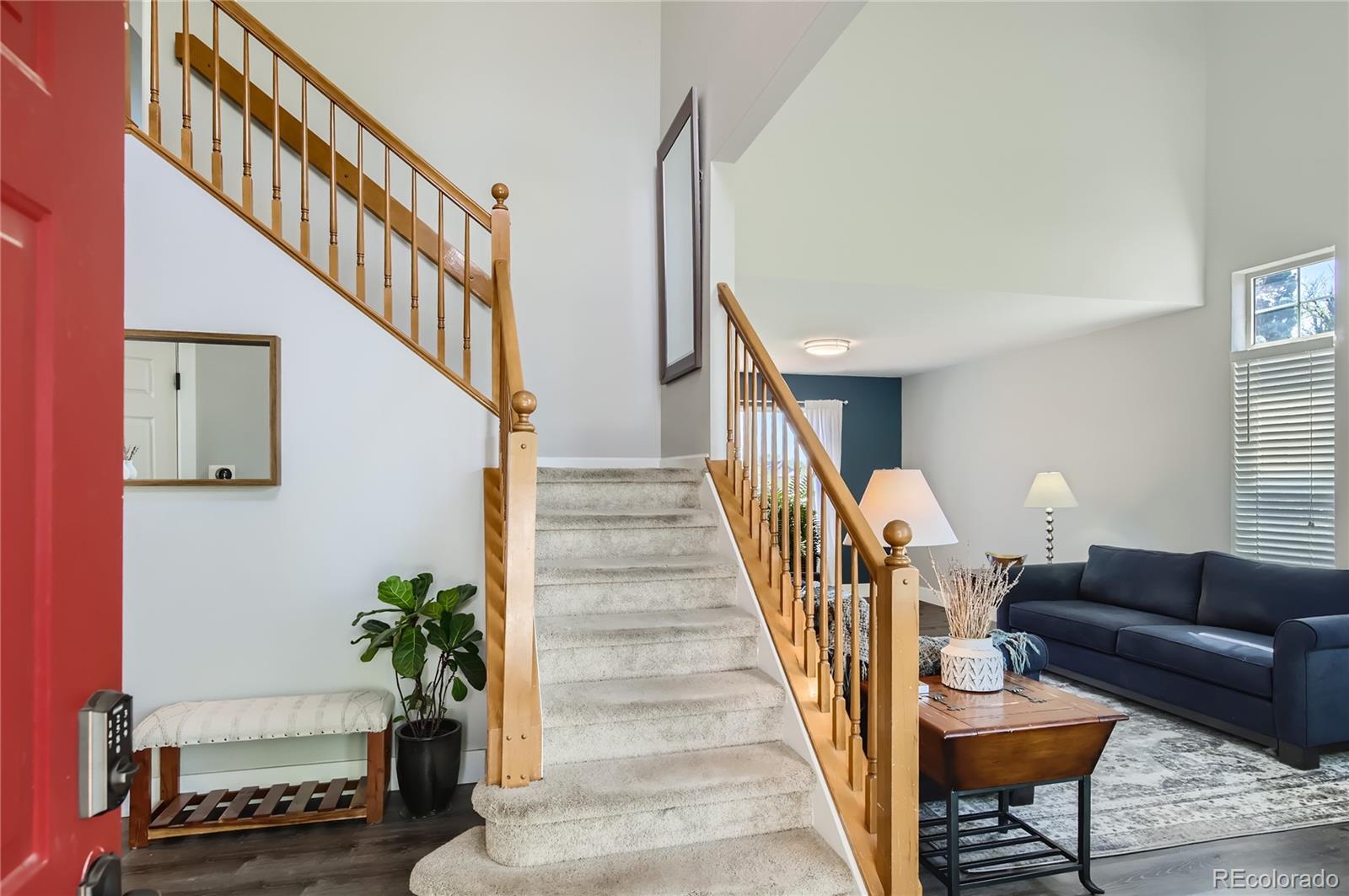 8481 West 95th Drive Westminster, CO 80021 - Photo 7 of 28 a living room with furniture and a potted plant