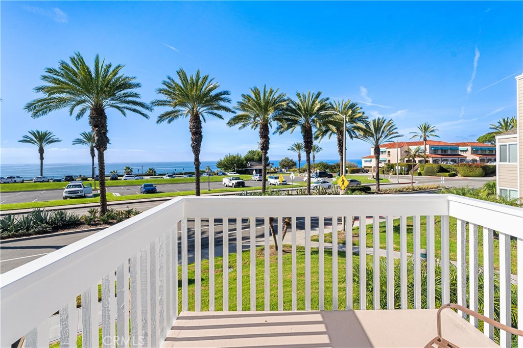 34002 Selva Road, Unit 369 Dana Point, CA 92629 - Photo 2 of 29 a view of a swimming pool with a garden and trees