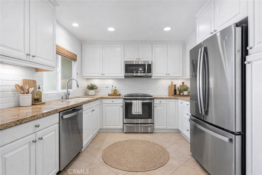 34002 Selva Road, Unit 369 Dana Point, CA 92629 - Photo 5 of 29 a kitchen with a refrigerator sink and microwave