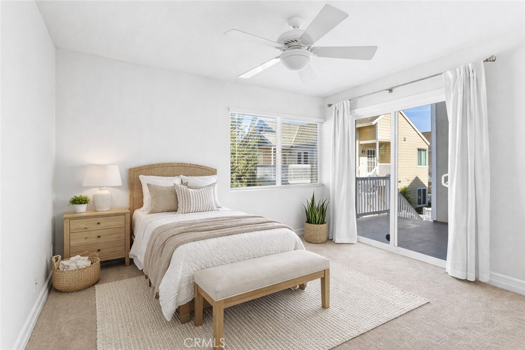 34002 Selva Road, Unit 369 Dana Point, CA 92629 - Photo 6 of 29 a bedroom with a large bed and a chandelier