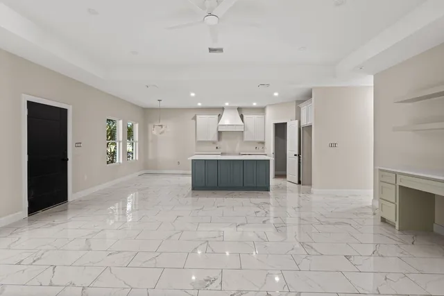 a large kitchen with cabinets and a stove