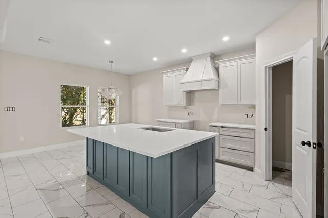a kitchen with a sink and cabinets