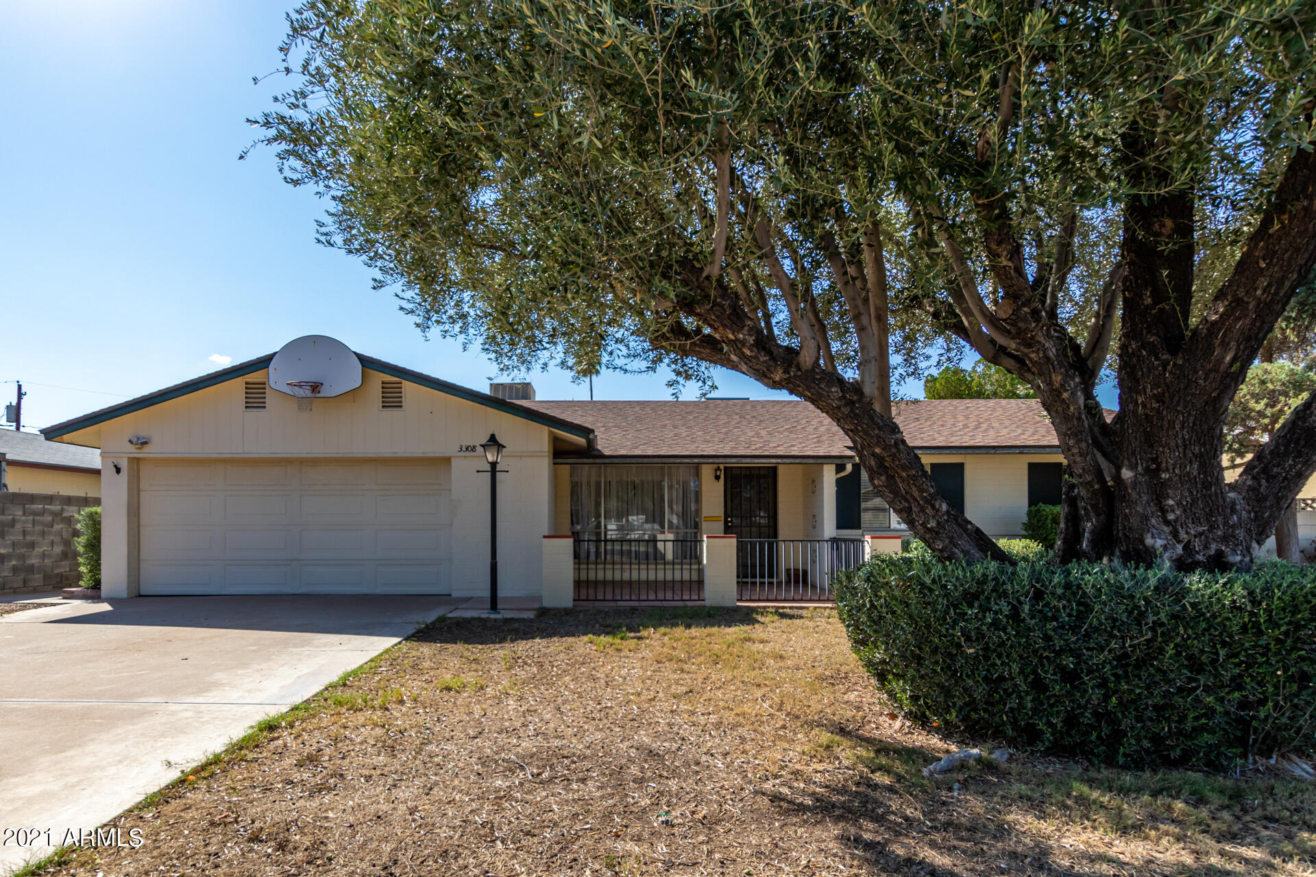 3308 South Newberry Road Tempe, AZ 85282 - Photo 1 of 38 a front view of a house with a yard and garage