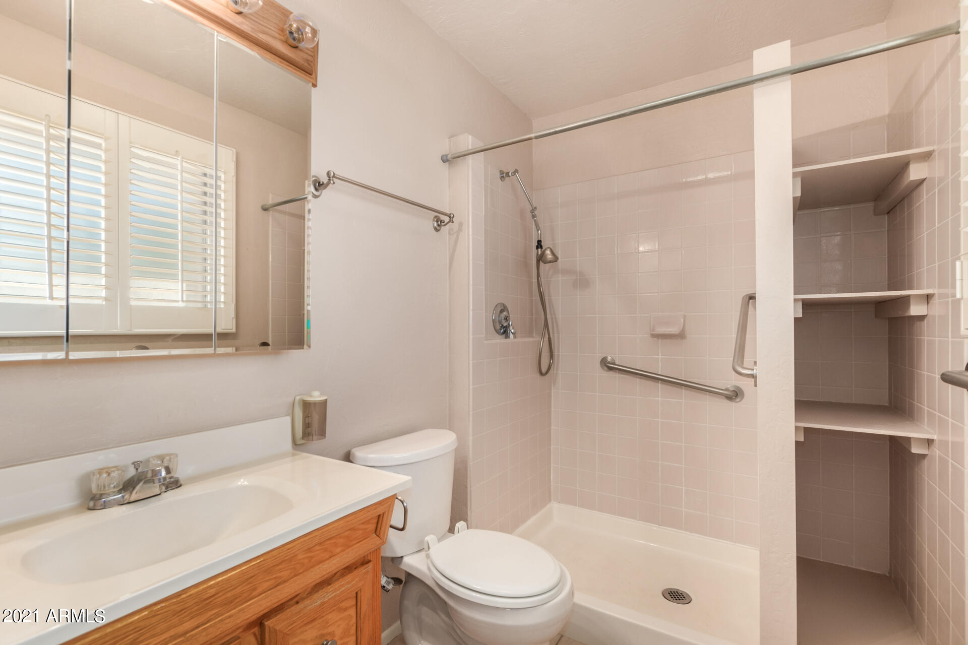 3308 South Newberry Road Tempe, AZ 85282 - Photo 21 of 38 a bathroom with a sink toilet and shower