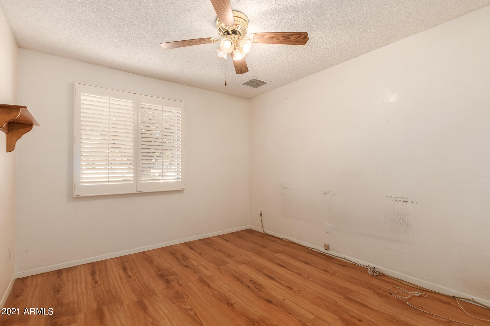 3308 South Newberry Road Tempe, AZ 85282 - Photo 22 of 38 wooden floor in an empty room with a window
