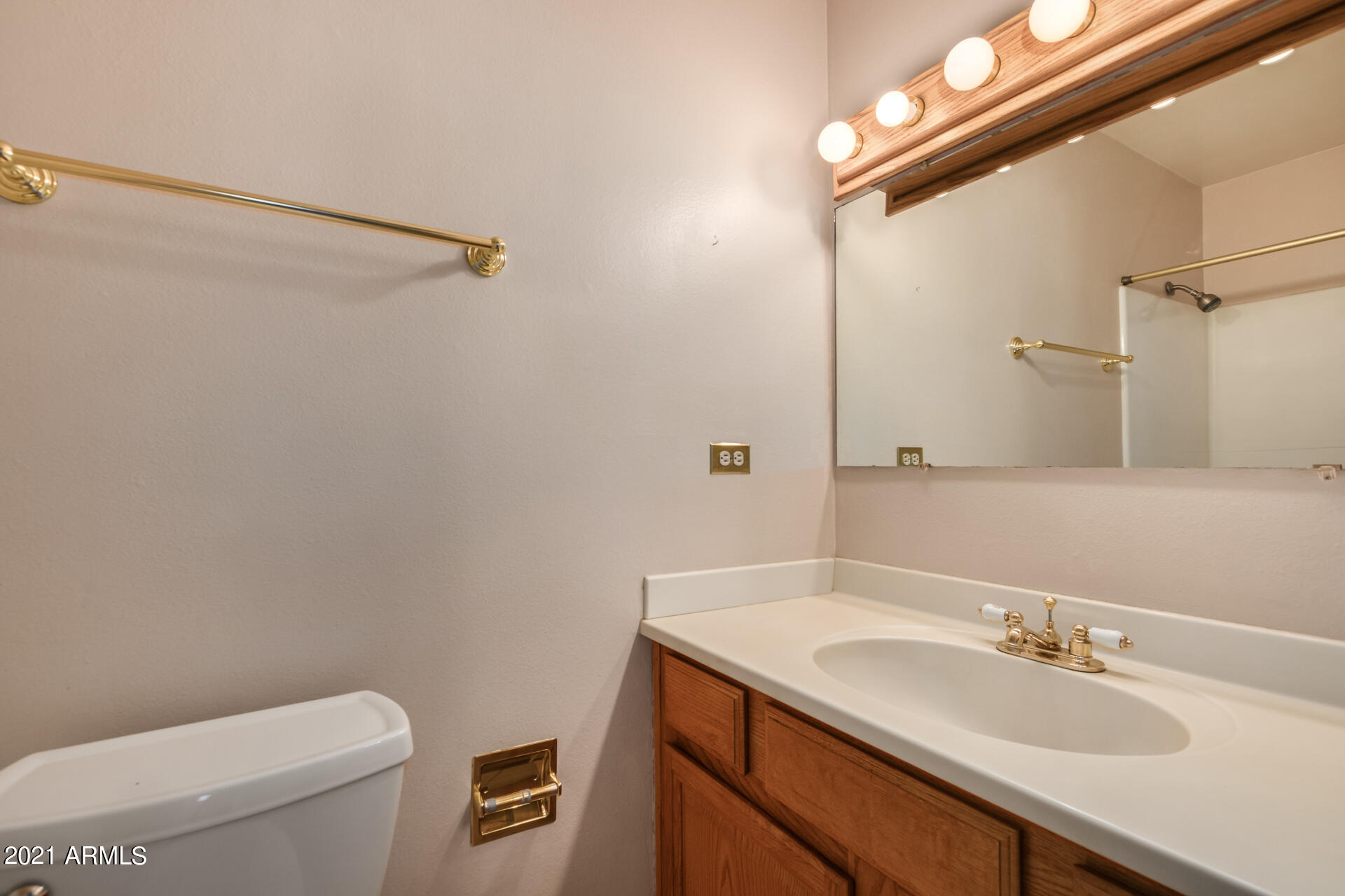 3308 South Newberry Road Tempe, AZ 85282 - Photo 24 of 38 a bathroom with a granite countertop sink a toilet and a mirror