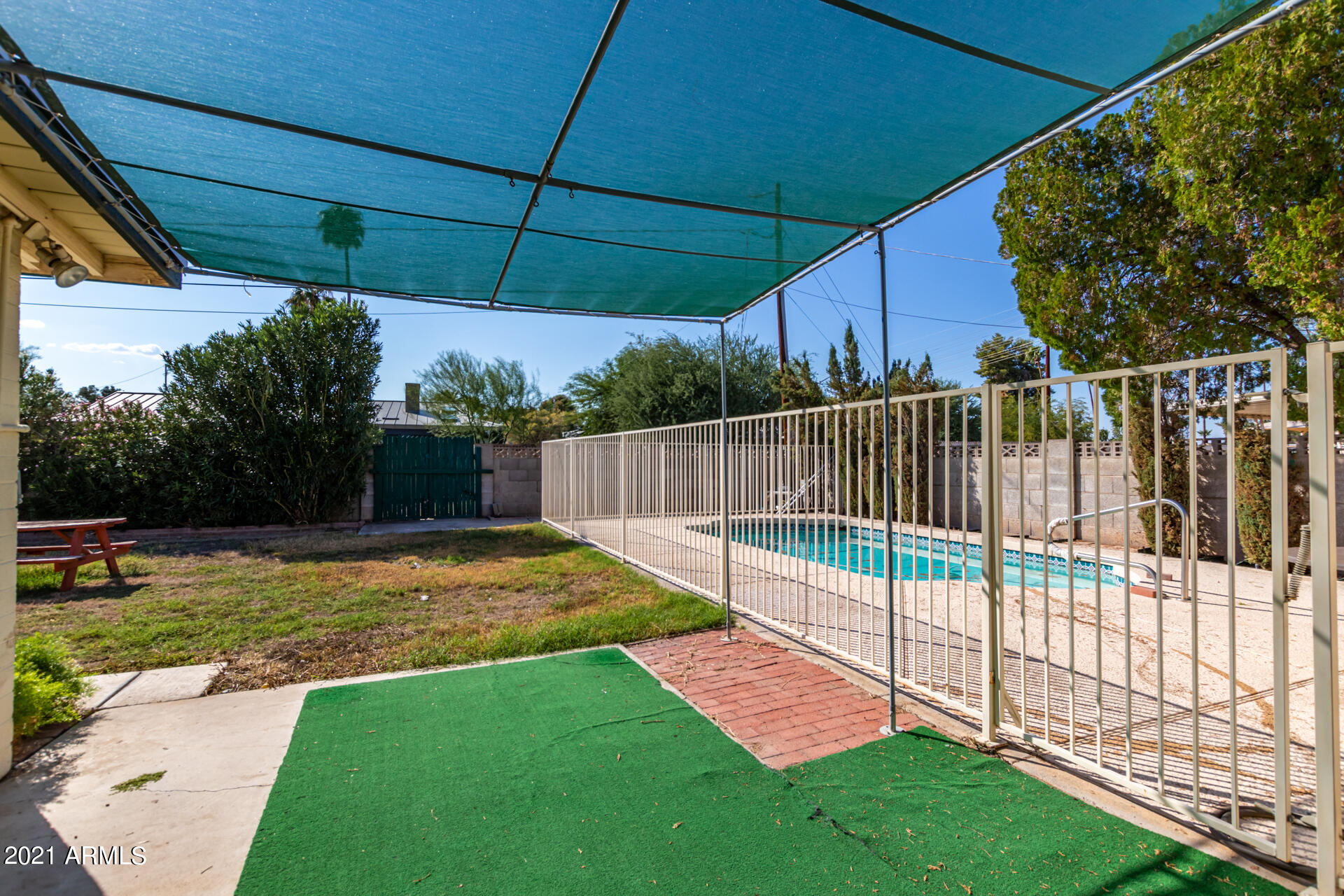 3308 South Newberry Road Tempe, AZ 85282 - Photo 32 of 38 a view of a backyard with wooden fence