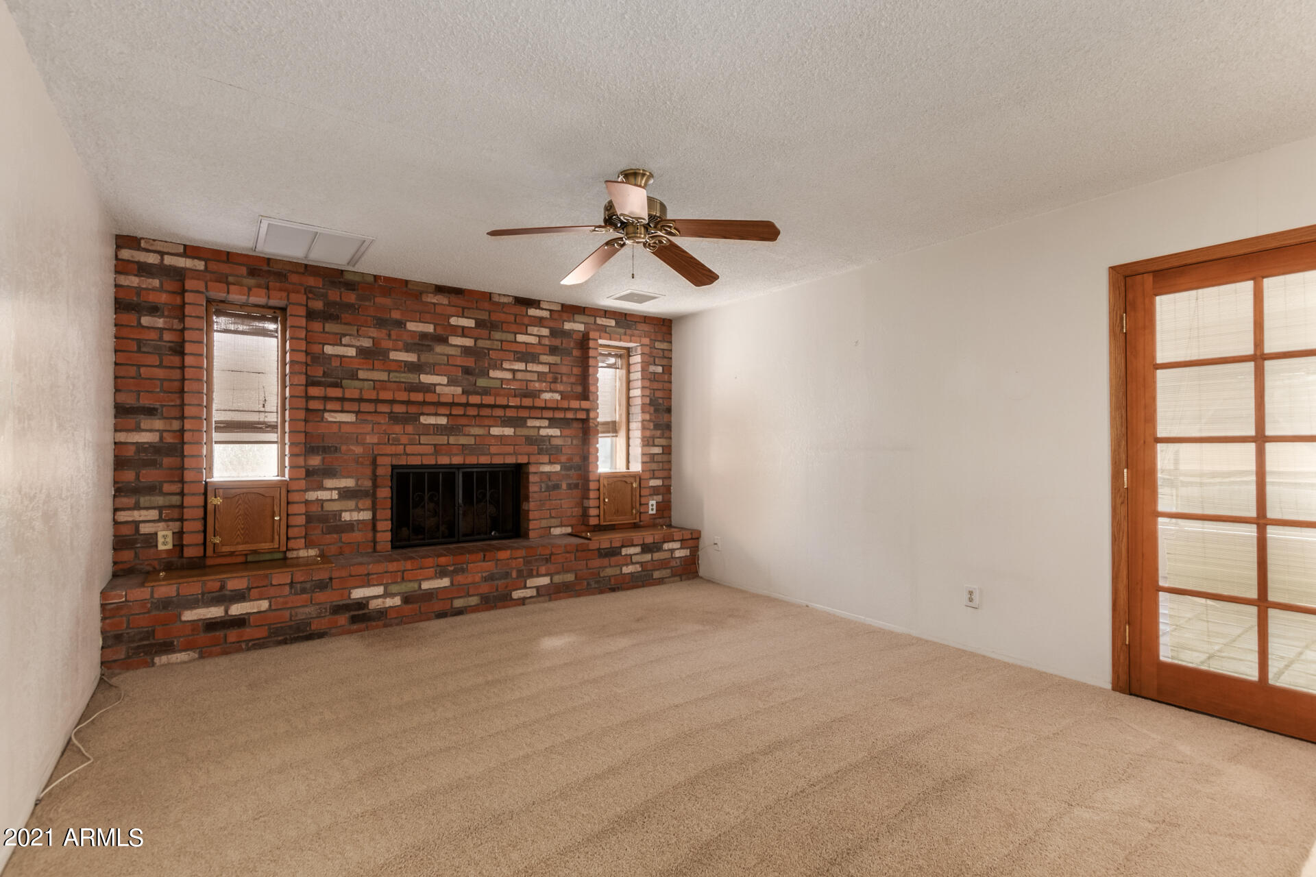 3308 South Newberry Road Tempe, AZ 85282 - Photo 10 of 38 a view of an empty room with window and fireplace