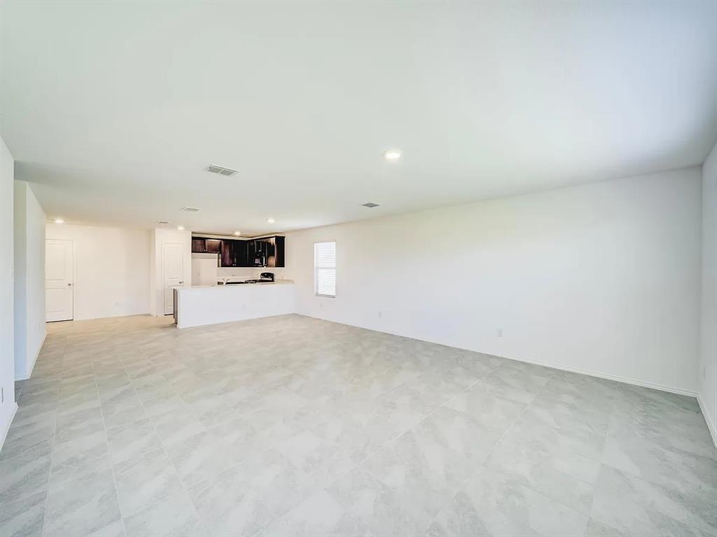 352 Sun Bluff Road Fort Worth, TX 76052 - Photo 12 of 33 Expansive open concept room featuring light-colored tile flooring and recessed lighting