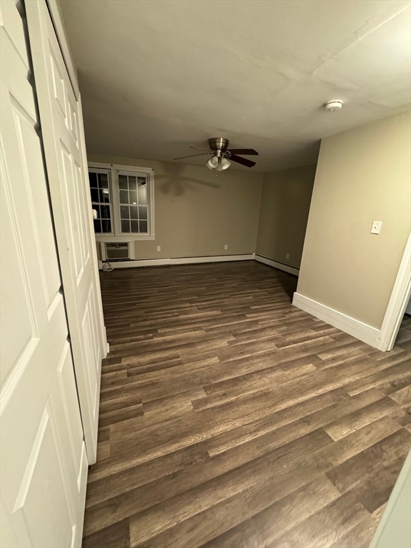 388 East Merrimack Street, Unit 2 Lowell, MA 01852 - Photo 2 of 9 a view of a room with wooden floor and stairs