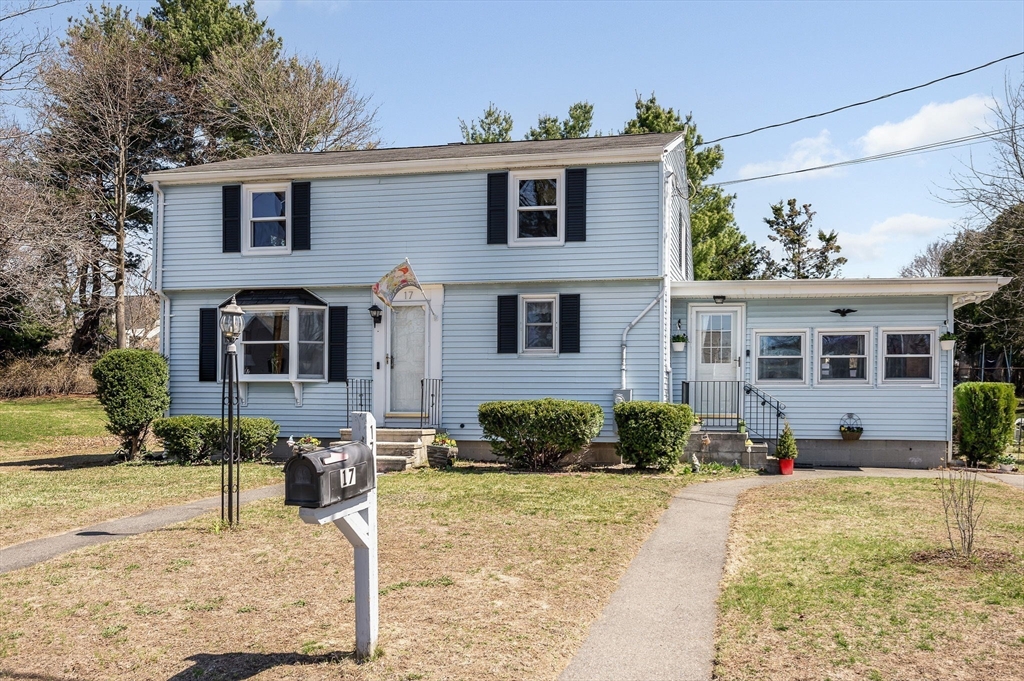 17 Roland Avenue Dracut, MA 01826 - Photo 30 of 37 a front view of a house with a yard