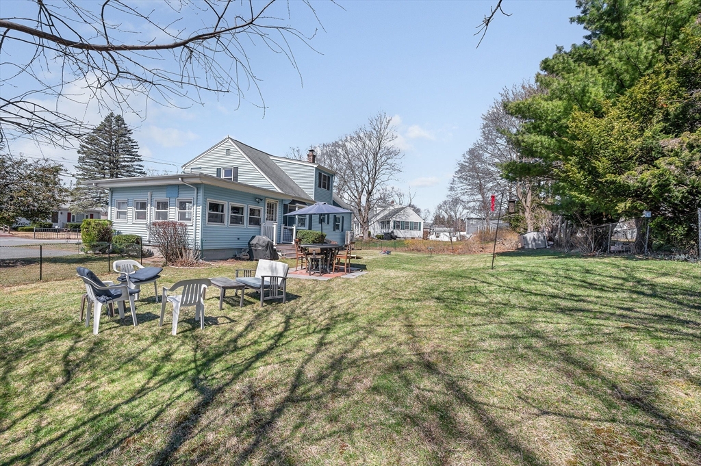 17 Roland Avenue Dracut, MA 01826 - Photo 32 of 37 a view of a house with backyard porch and sitting area