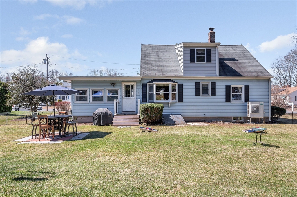 17 Roland Avenue Dracut, MA 01826 - Photo 33 of 37 a front view of a house with garden