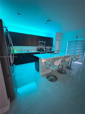 a view of a room with chairs and a table