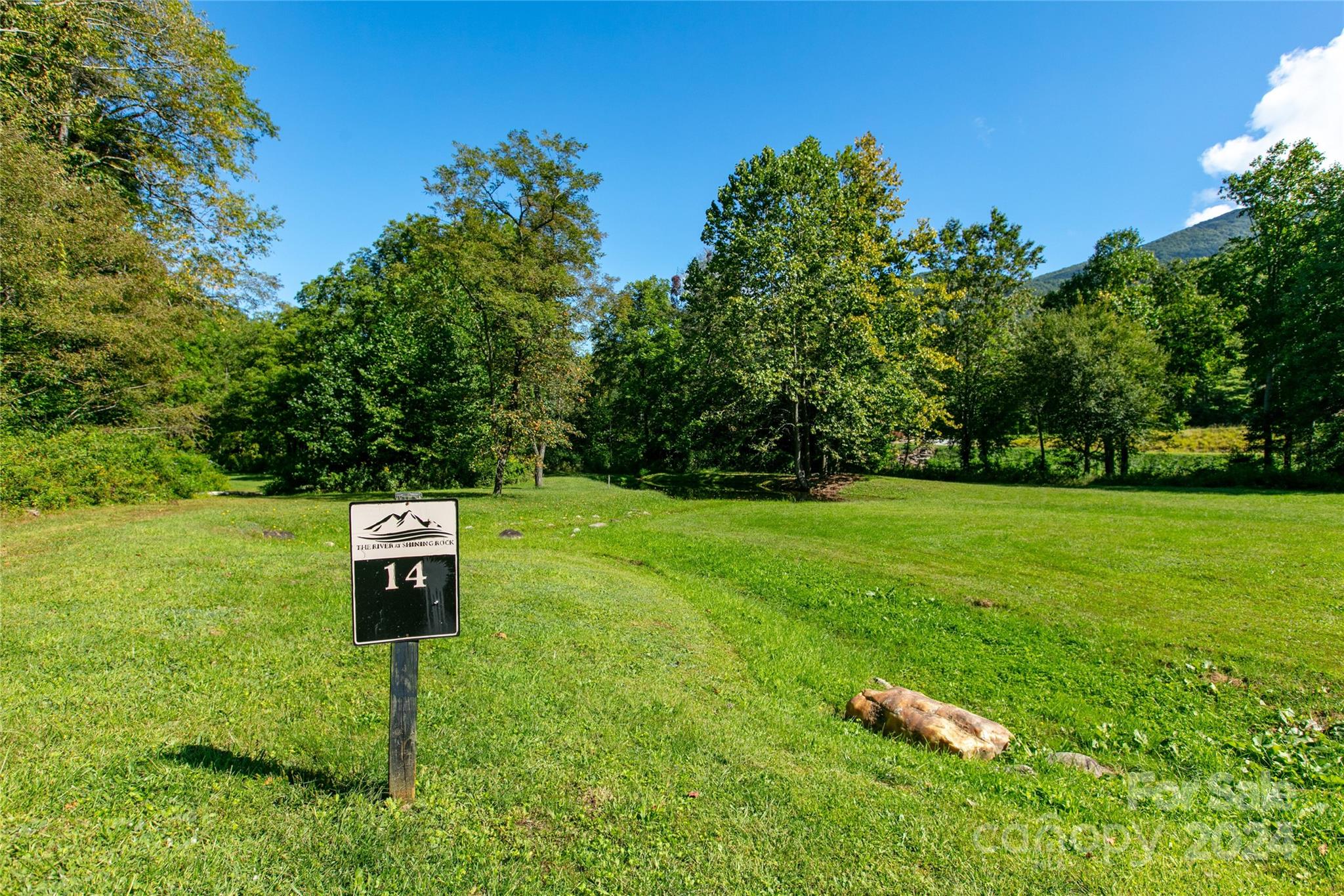 0 Scout Trail, Unit 14 Canton, NC 28716 - Photo 1 of 8 a backyard of a house with table and chairs