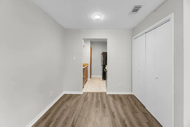 wooden floor in a hall with an entryway