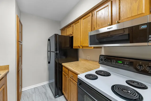 a kitchen with a stove and a microwave