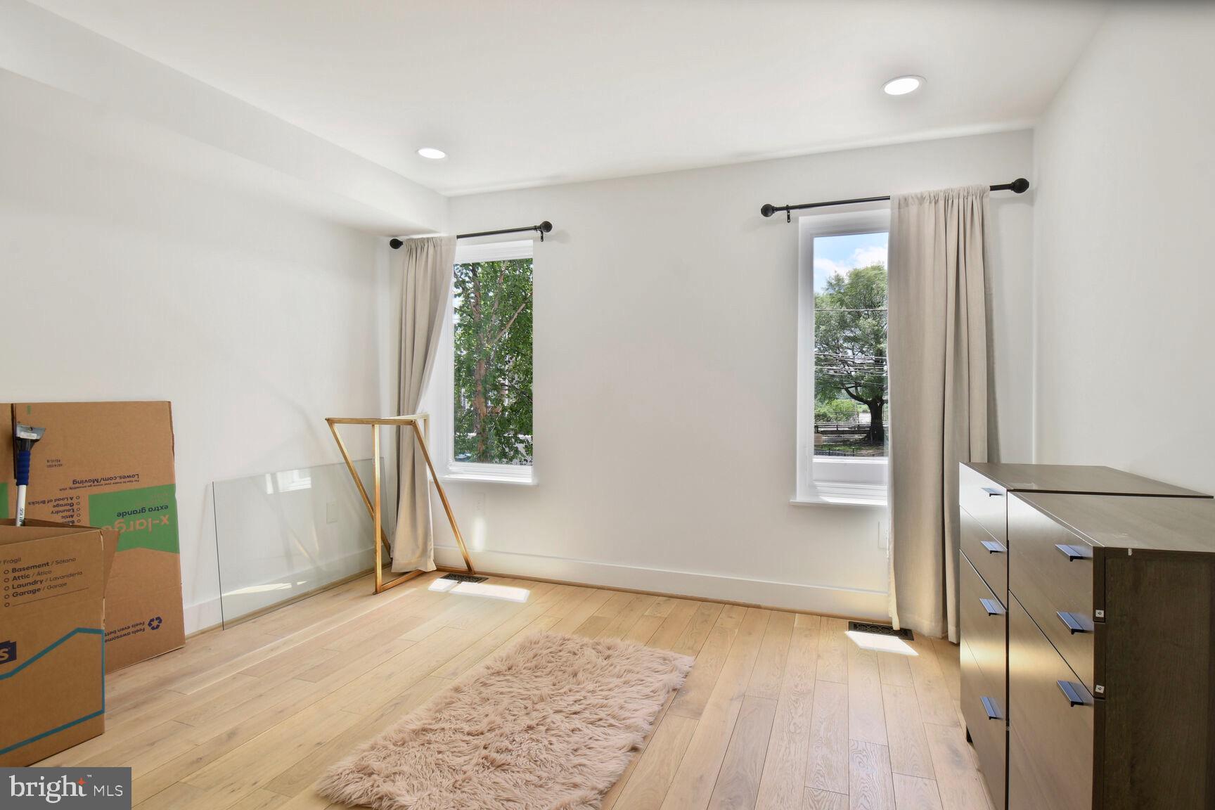 1427 K Street Southeast Washington, DC 20003 - Photo 12 of 30 a view of empty room with wooden floor and fan