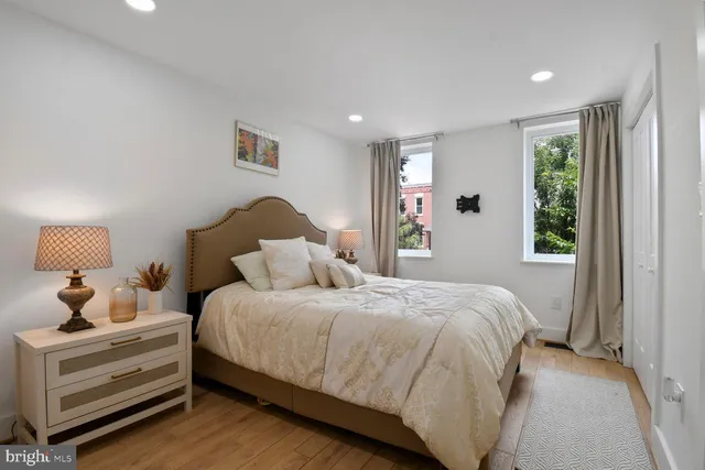 a bedroom with a bed and a window