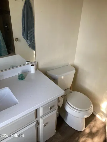 a bathroom with a toilet and a sink
