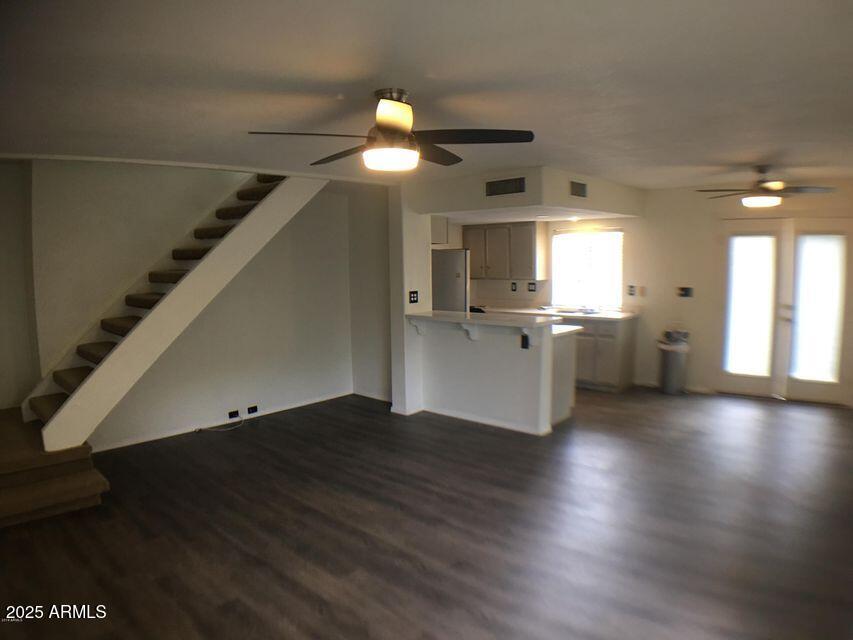 8634 South 51st Street, Unit 3 Phoenix, AZ 85044 - Photo 3 of 18 a view of a kitchen with a fridge and wooden floor