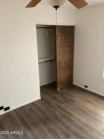 an empty room with wooden floor