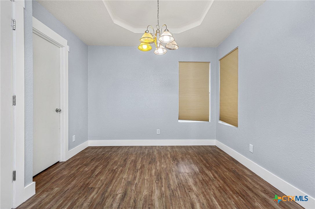 3208 Viewcrest Drive Killeen, TX 76549 - Photo 5 of 15 a view of empty room with window and wooden floor