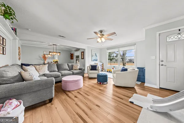 a living room with furniture and a table