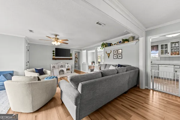 a kitchen with granite countertop a sink stove and cabinets