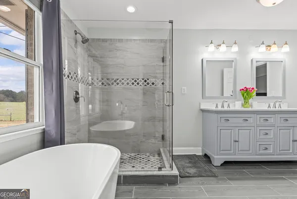 a view of a yard with plants and trees