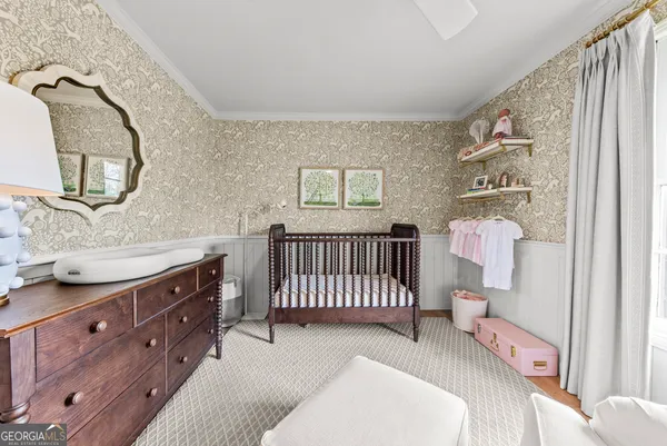a view of a yard with table and chairs under an umbrella