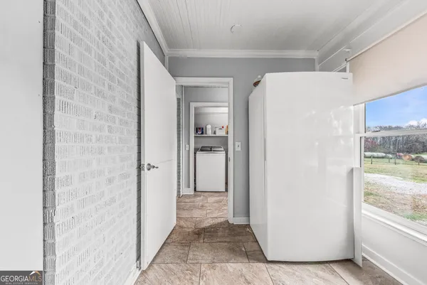 a backyard of a house with table and chairs