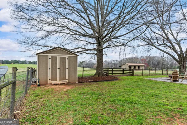 a view of a swimming pool with a yard